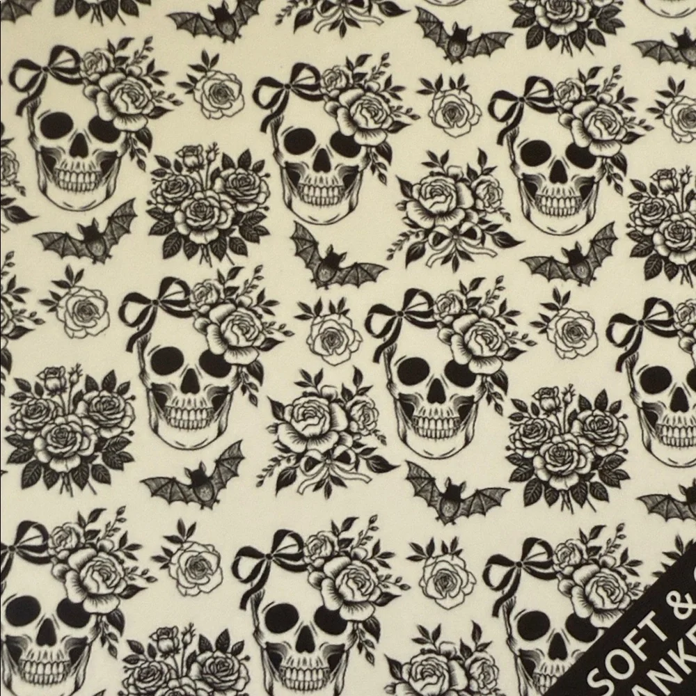 Deborah Connolly designs Halloween skull and bow queen blanket☠️🥀🦇